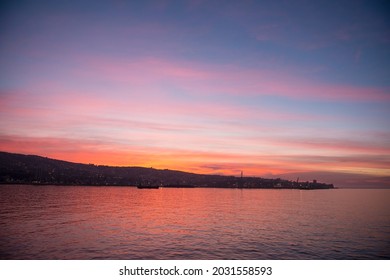Sunset in Valpraiso city with harbor view and hills by Pacific Ocean, Chile.