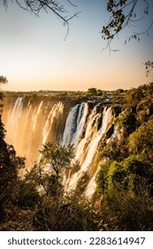 Sunset at the Victoria Falls, also known as Mosi-oa-Tunya, in Zambia, closeby the border to Zimbabwe