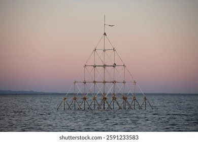 Sunset view of the abandoned sunken structures on the shore of Bombay beach of the Salton Sea in California, USA.
