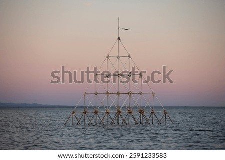 Sunset view of the abandoned sunken structures on the shore of Bombay beach of the Salton Sea in California, USA.