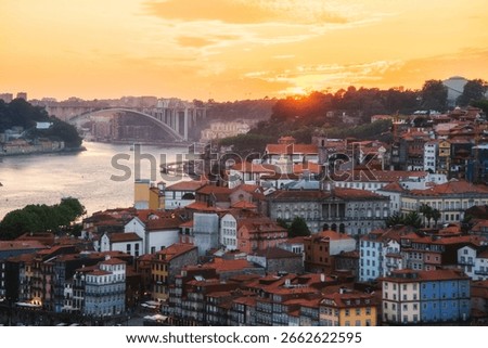 Sunset view of Arrabida Bridge and Douro River in Porto, Portugal