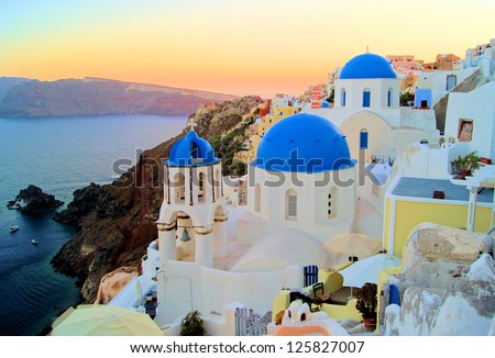 Sunset view of the blue dome churches of Santorini, Greece