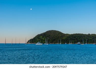 Sunset view of boats mooring at Torrent bay at Abel Tasman national park in New Zealand