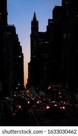 Sunset View Of Broadway Street From Soho With The Financial Skyline And The Woolworth Building Silhouette On The Background, New York.