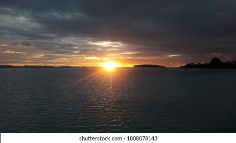 Sunset View  With Dark Clouds And High Tide At Gan Island.