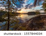 A sunset view of Eagle Lake from the top of a large granite outcropping on an unnamed island located in Northwest Ontario, Canada.