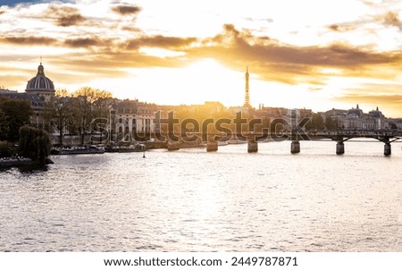 Sunset view of the Eiffel Tower in Paris from along the Seine