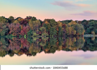 Sunset View Of Fall Foliage At Lake In Maryland.