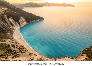 Sunset view of the famous Myrtos beach on Kefalonia island, Ionian sea, Greece. Top view of the popular Myrtos beach.