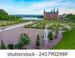 Sunset view of gardens of Frederiksborg Slot palace in Denmark.