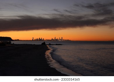 Sunset view of the Gold Coast skyline with Currumbin rock in foreground seen from Elephant rock in Currumbin, Queensland