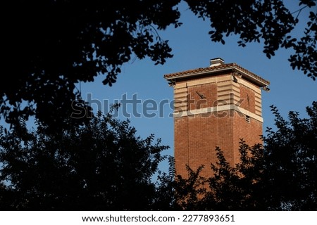 Sunset view of the historic clock tower of the downtown skyline of La Verne, California, USA.