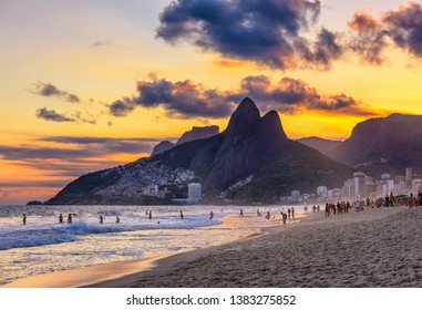 Sunset view of Ipanema beach, Leblon beach and the Mountain Dois Irmao in Rio de Janeiro, Brazil. Ipanema beach is the most famous beach of Rio de Janeiro, Brazil. Sunset cityscape of Rio de Janeiro