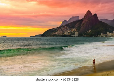 Sunset view of Ipanema beach and mountain Dois Irmao (Two Brother) in Rio de Janeiro, Brazil. Ipanema beach is the most famous beach of Rio de Janeiro