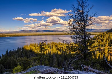 Sunset view of the Jenny Lake from the Jenny Lake Loop Trail near Inspiration Point in Grand Teton National Park, Wyoming, USA.