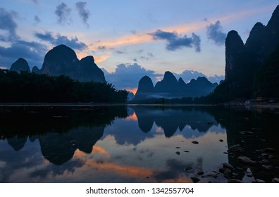 Sunset view of the Karst Mountains near Yangshuo in Guangxi, China. 