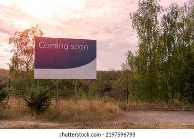 Sunset View Of Large Billboard Street Sign With Comin Soon Sign