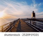 Sunset view of the lighthouse and pier in Charlevoix, Michigan