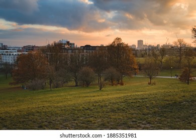 Sunset view of London from atop Primrose Hill in the midst of Autumn