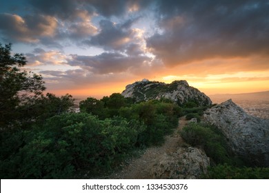 Sunset view of Lycabettus hill with church of St George on the summit.  - Shutterstock ID 1334530376
