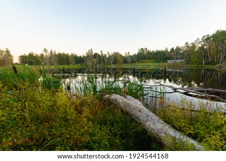 Sunset view of the MacLaren pond, in Fundy National Park, New Brunswick, Canada