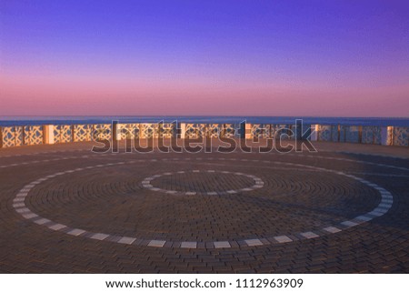 Similar – wooden platform with blue posts with ropes and orange lifebuoys on the background of the sea and sky with clouds Egypt Dahab South Sinai