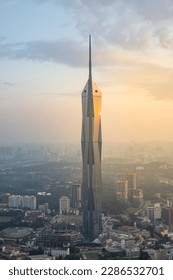 Sunset view of Merdeka tower with golden hour light.