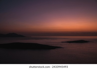 Sunset view from Monteferro's Rosa dos Ventos viewpoint, showcasing a serene horizon over tranquil seas. Silhouettes of Estelas Islands and distant Cabo Silleiro under a vibrant orange and purple sky. - Powered by Shutterstock