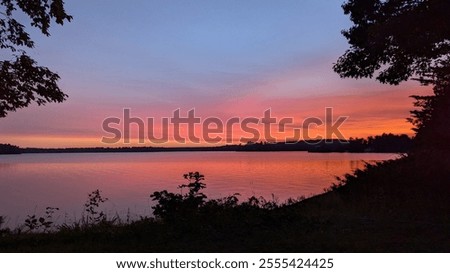 A sunset view next to a lake. 