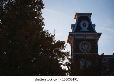 Sunset View Of Old Main Clock Tower On The Campus Of The University Of Arkansas. 