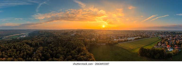 Sunset view over the beautiful landscape in southern bavaria with the monastery of Schaeftlarn.