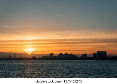 Sunset View Over The Long Beach Skyline From The Belmont Pier In Long Beach, California