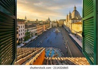Sunset View From A Penthouse Resort Hotel Room Through A Window With Shutters Of The Famous Piazza Navona In Rome, Italy.