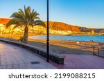 Sunset view of Playa de las Vistas at Tenerife, Canary islands, Spain.