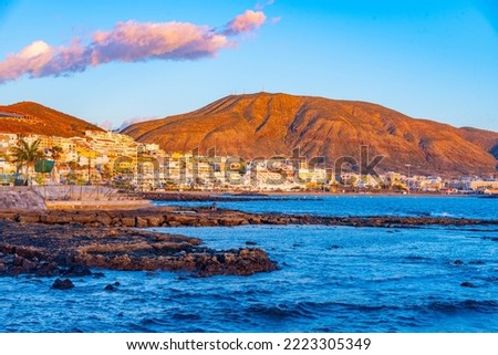 Sunset view of Playa de los Cristianos at Tenerife, Canary islands, Spain.