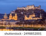 Sunset view of Salzburg with Hohensalzburg Fortress and Salzburg Cathedral, Austria.