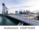 sunset view of singapore city down town central district skyline with highway bridge and many skyscraper business  buildings at marina bay area in summer time. Sinngapore city panorama view