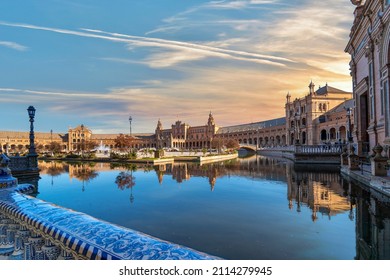 Sunset view of the small public pond and buildings in the Plaza de Espana, or Spanish Square, in Seville, Spain