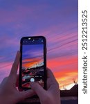 Sunset view through iPhone taking photo