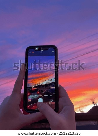 Sunset view through iPhone taking photo