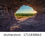 Sunset view through the rock, in Pedra furada, Jalapao, Brazil