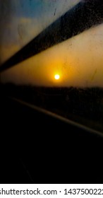 Sunset View From Travelling Time Framing With Dust Particles On The Window Of Public Transport...grains Are Dust Particles Not Are Noise Ant Type Of...