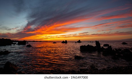 Sunset Viewed From A Rocky Beach, South Kohala, Hawaii. 