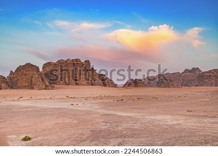 Sunset views of the rocky formations in Wadi Rum, Jordan.