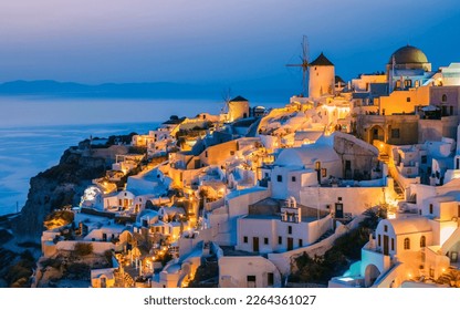 Sunset at the village of Oia Santorini Greece during summer with whitewashed homes and churches, Greek Island Aegean Cyclades - Shutterstock ID 2264361027