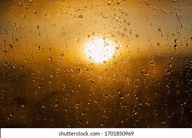 Sunset Warm Light Through The Wet Window After Rain 