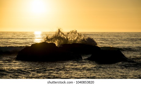 Sunset Waves over Rocks