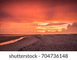 Sunset While Walking Down the Beach 