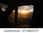 sunset in a window of a Van