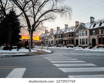 Sunset in the winter in downtown Birmingham, Michigan with townhomes in the foreground - Shutterstock ID 2273957769